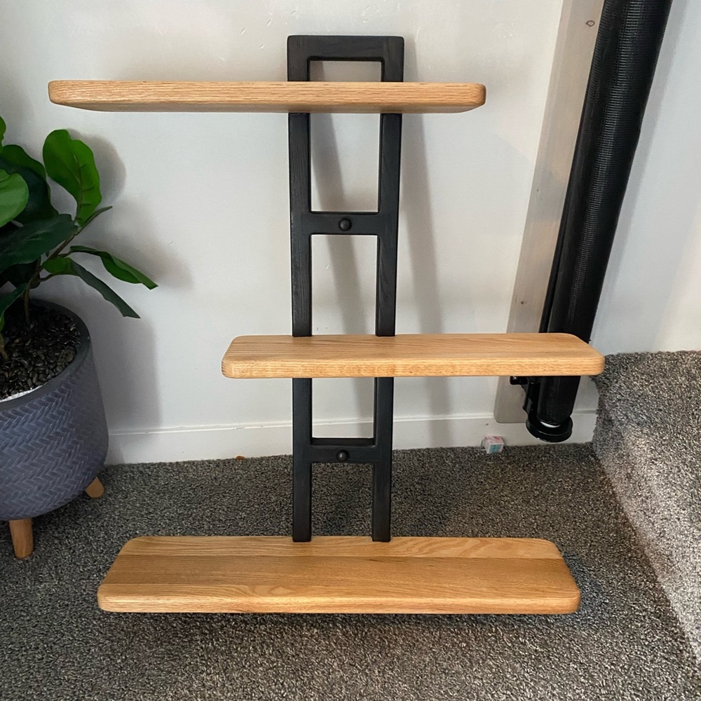 Black and Brown Display Shelves with Geometric Design